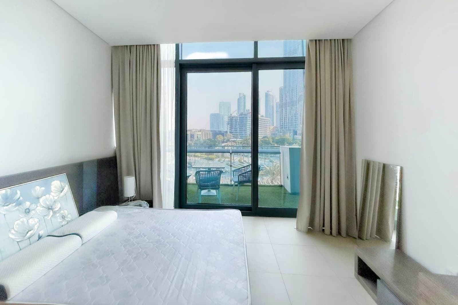 Bedroom showing entry door and wardrobe